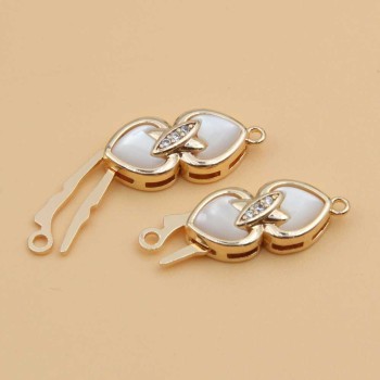 Chiusura a slitta con intarzi in madreperla cuore 16x7 mm gold plated 1 pz Chiusura a slitta con intarzi in madreperla cuore 16x7 mm gold plated 1 pz