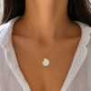 Ciondolo in acciaio oro con perla conchiglia 22 mm conf. 1 pz Ciondolo in acciaio oro con perla conchiglia 22 mm conf. 1 pz