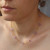 Collana acciaio con fiori di cristallo lilla finitura oro