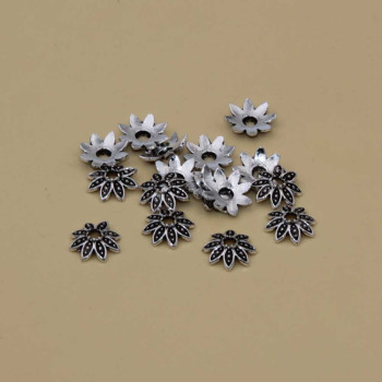 Coppette fiore in zama 7 mm conf. 50 pz