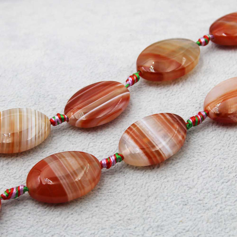 Agata striata liscia ovale piatta su due lati 30x20 mm 2 pz (cor-2lat) - pietreeminuterie.com