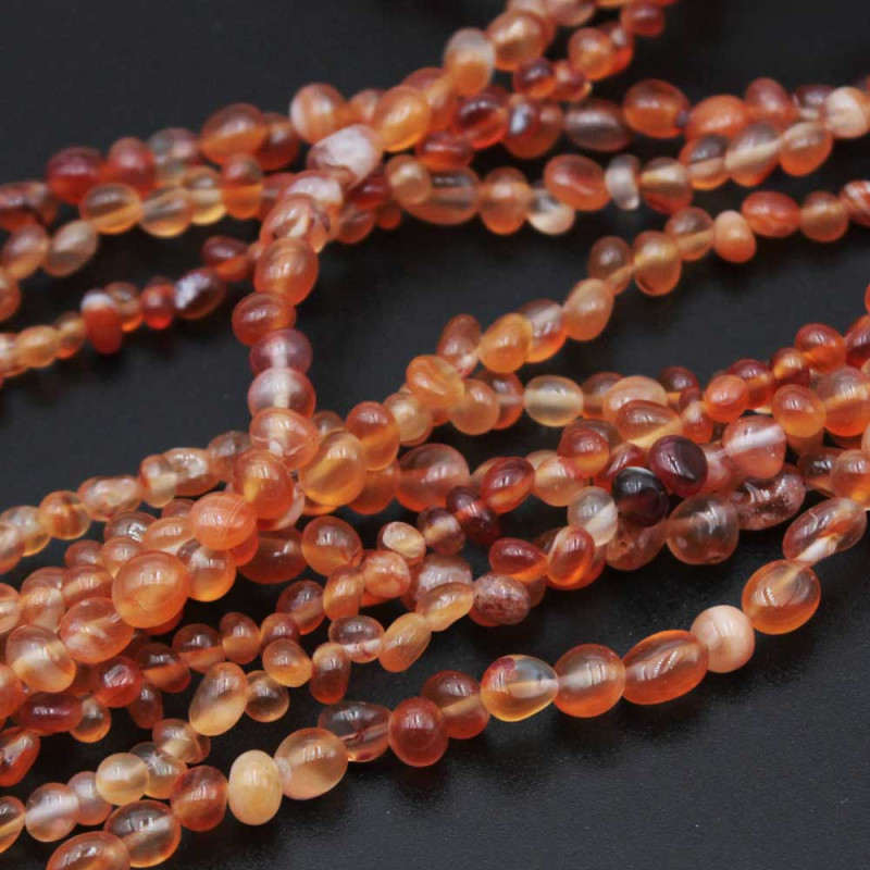 Chicchi di riso irregolari corniola 5/9 mm ilo 40 cm (nio-a-1) - pietreeminuterie.com