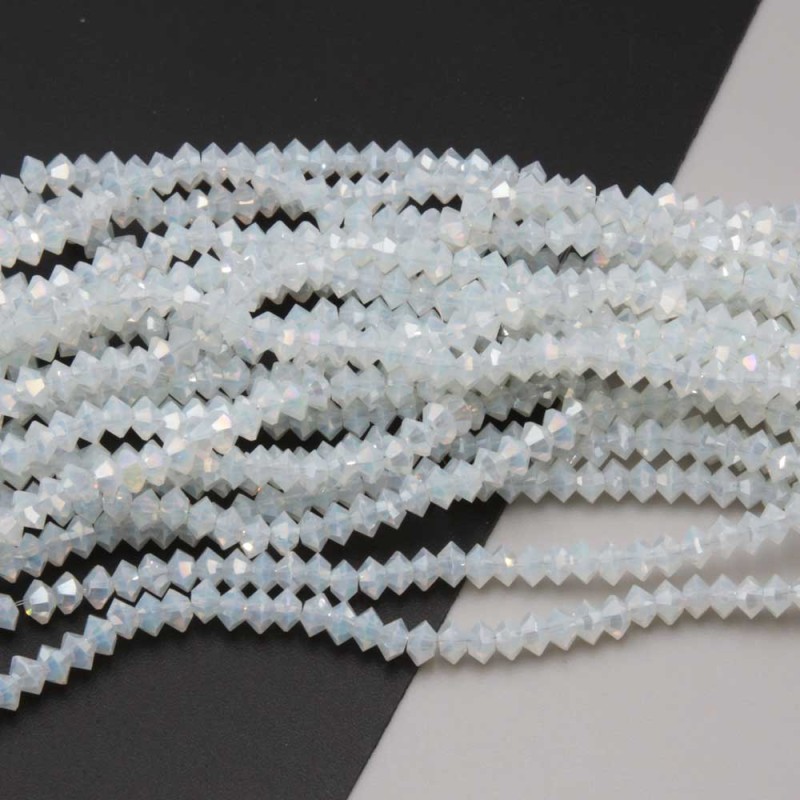 Cristalli bicono 4x3 mm opale a/b filo 40 cm (bic-4x31a) - pietreeminuterie.com