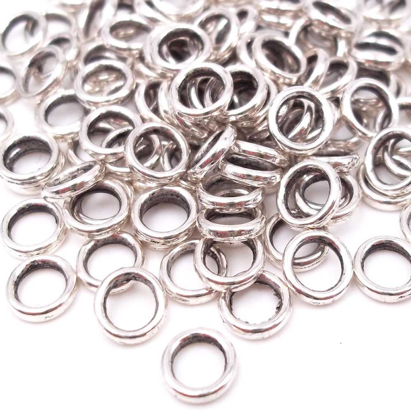 Distanziatore ad anellino 6 mm foro 4 mm pacco 50 pz (dr31) - pietreeminuterie.com