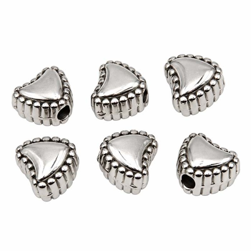 Cuori acciaio decorato 7 foro 1.5 mm circa conf. 10 pz Cuori acciaio decorato 7 foro 1.5 mm circa conf. 10 pz