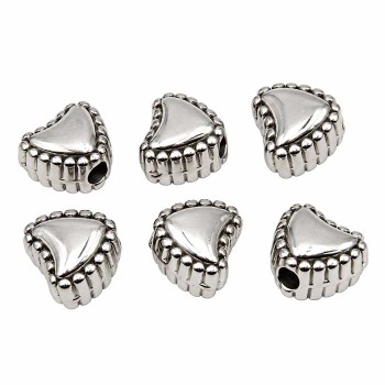 Cuori acciaio decorato 7 foro 1.5 mm circa conf. 10 pz Cuori acciaio decorato 7 foro 1.5 mm circa conf. 10 pz