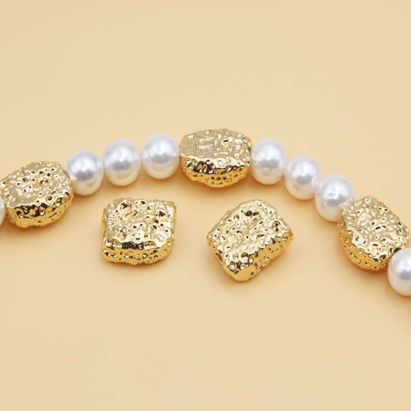 Distanziatori gold plated pepita grezza 11x9 mm 2 pz - 7676-1-11 - pietreeminuterie.com Distanziatori gold plated pepita grezza 11x9 mm 2 pz (7676-1-11) - pietreeminuterie.com
