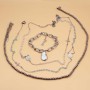 Lotto bijou acciaio 3 collane rosario e un bracciale con perle 