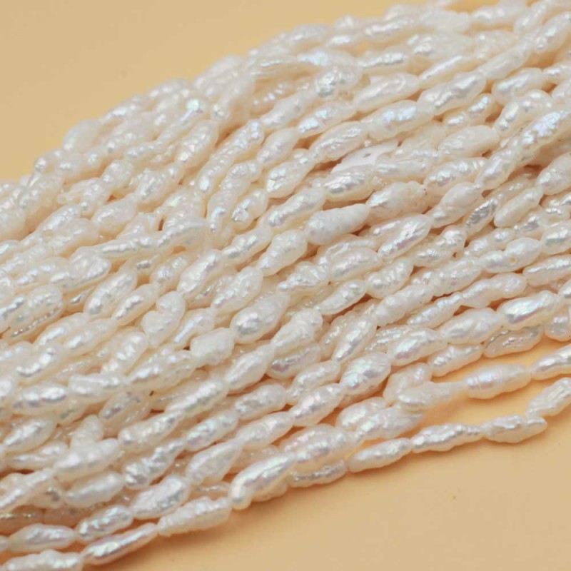 Perle di fiume pepita 5x3 mm bianche AAAA Quality filo 35 cm (perl-4-5-mm) - pietreeminuterie.com