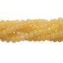 Rondelle giada gialla chiara 4x2 mm filo 40 cm